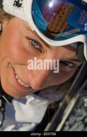 portrait of a young woman with blue eyes and ski goggle, France Stock Photo