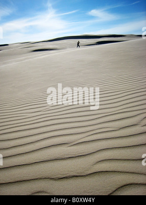 man on a dune, Poland, Pomerania, Slowinski National Park Stock Photo