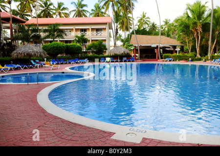 Swimming pool and accommodation at tropical resort Stock Photo