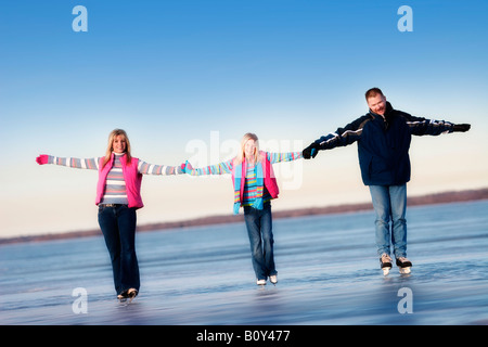 Family skating together Stock Photo