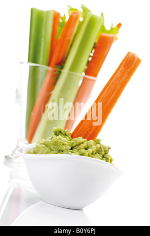 Guacamole with vegetable sticks Stock Photo