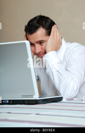 Young man with laptop, portrait Stock Photo
