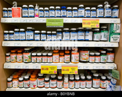 Rows of multi vitamins in Holland & Barrett shop, London England UK Stock Photo