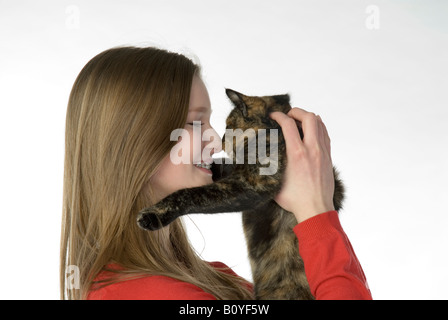 Blonde girl (13-14) holding cat, portrait Stock Photo