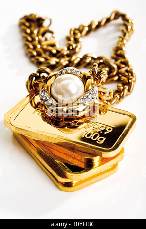 Gold bars and necklace Stock Photo