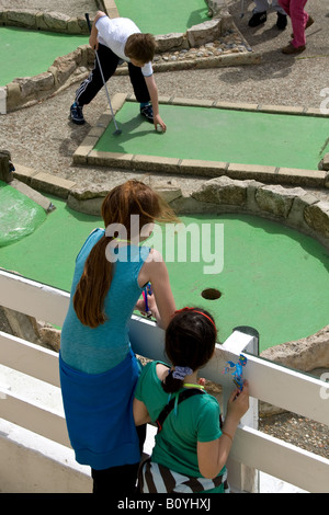 childen playing crazy golf on brighton seafront Stock Photo