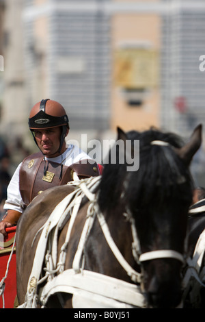 Centurion on a horse in the Piazza del Popolo in Rome, Italy, Roman Centurion, Man dressed as a Roman soldier, Roman Chariot Stock Photo