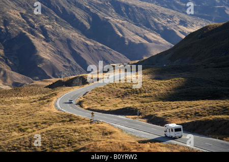 Campervan and Crown Range Road between Queenstown and Wanaka South Island New Zealand Stock Photo