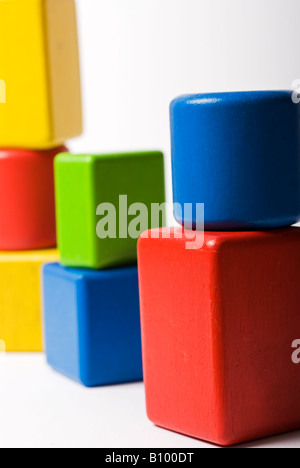 Stock photo of a pile of brightly coloured childrens building bricks The photo is shot against a white background Stock Photo