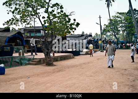 INDIA ALLEPPY Renovated rice boats on canals lined up for rental in the backwaters of Kerala near Alleppey Stock Photo