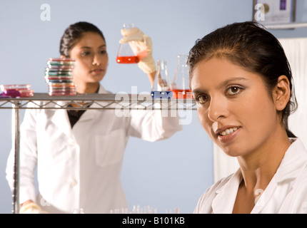 Female researchers working in a lab, trying to discover new  alternative energies. Stock Photo