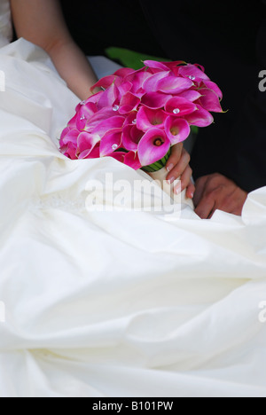 Bride and groom Closeup on wedding bouquet Stock Photo