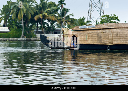 INDIA KERALA Renovated rice boat with solar panels on canals in the backwaters of Kerala Stock Photo