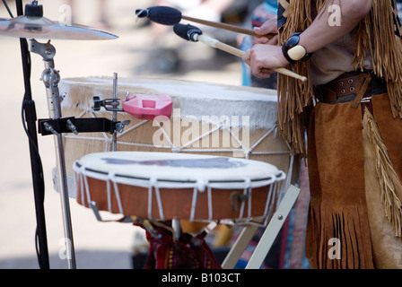 Native American Indian drums being played by buskers in Great Yarmouth Market Place Stock Photo