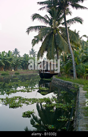 INDIA KERALA Renovated rice boat on canal in the backwaters of Kerala near Alleppey Stock Photo