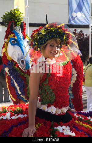 dh Flower Festival FUNCHAL MADEIRA Girl in flower costume and model horse decorated with fresh carnations carnival Stock Photo