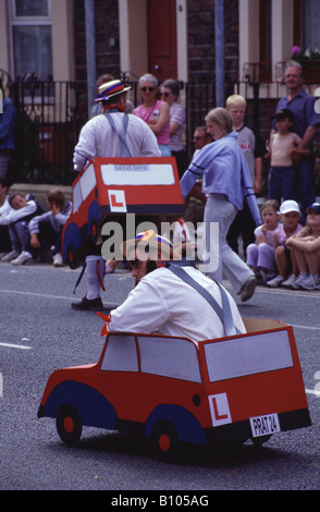 Learner drivers in summer carnival parade Stock Photo