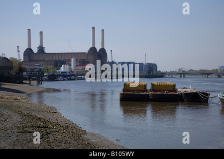 Barges moored on river Thames at low tide on Battersea Reach London uk Stock Photo