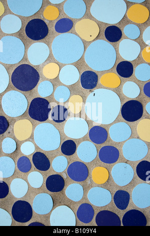 BROKEN TILE FRAGMENTS SET IN CONCRETE  VERTICAL BDB10021 Stock Photo