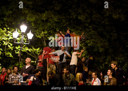 Delirious Manchester United fans celebrate in Manchester city centre after their team won the UEFA Champions League. Stock Photo