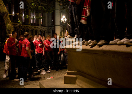 Delirious Manchester United fans celebrate in Manchester city centre after their team won the UEFA Champions League. Stock Photo