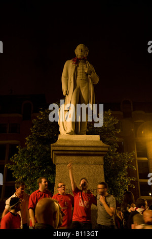 Delirious Manchester United fans celebrate outside Manchester's Town Hall after their team won the Champions League. Stock Photo