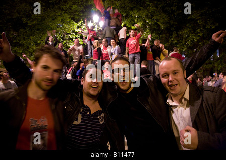 Delirious Manchester United fans celebrate in Manchester city centre after their team won the UEFA Champions League. Stock Photo