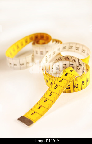 Close up of a yellow measuring tape Stock Photo