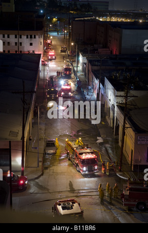 Fire engines arriving at downtown fire Stock Photo