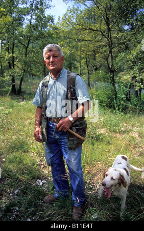 italy umbria valnerina a man hunting truffles with his dog Stock Photo