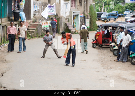 Street cricket in a village in Sri Lanka Stock Photo