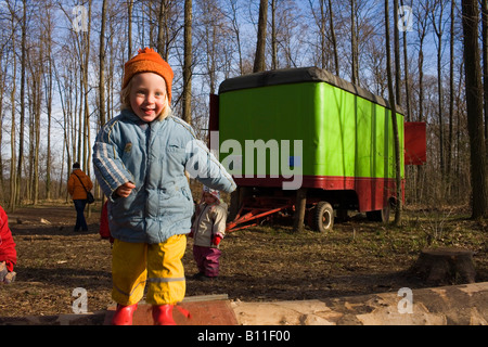 Children playing in the forest kindergarden Stock Photo