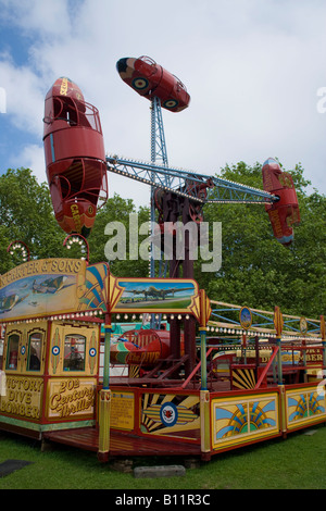 50s People Summer classic coconut throwing fair funfair helter skelter merry go round swings Stock Photo