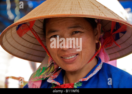 Portrait Flower Hmong woman in straw hat Bac Ha Sunday Market Northern Vietnam Stock Photo