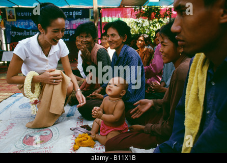 Princess Rattana Princess Rattana Norodom of Cambodia handing out alms and interacting ...