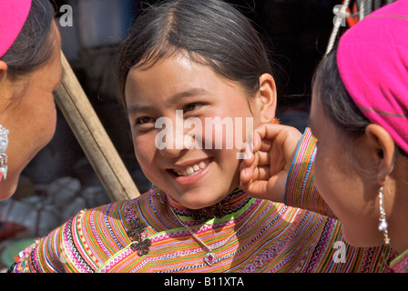 Portrait pretty young Flower Hmong girl Bac Ha Sunday Market Northern Vietnam Stock Photo