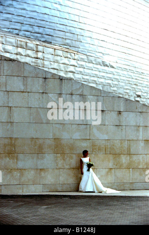 Model poses as bride outside Guggenheim Museum Bilbao Spain Stock Photo