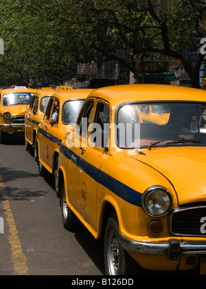 row of vintage Ambassador taxis at rush hour in Calcutta Stock Photo