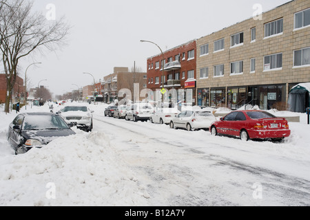 A scene along snow bound Montreal suburban street after a heavy snow fall. Stock Photo