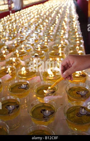 Lighting Up Oil Lamps On Wesak Day Celebration Stock Photo