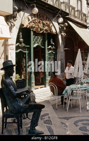 A bronze statue of writer and poet Fernando Pessoa outside the cafe A Brasileira on Rua Garrett Barrio alto Lisbon Portugal Stock Photo