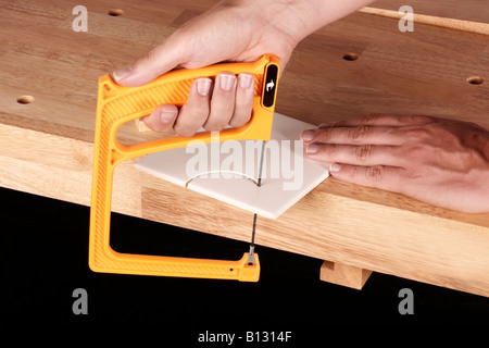 MAN CUTTING A TILE Stock Photo