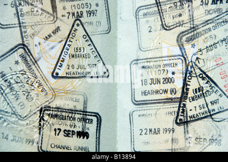 English mixed visa stamps in a passport to enter United Kingdom from known UK border control Heathrow, Gatwick, Channel Tunnel Stock Photo