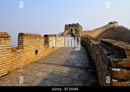 Great Wall of China with watchtowers visible in golden late afternoon light at Mutianyu around 85kms from Beijing China Stock Photo