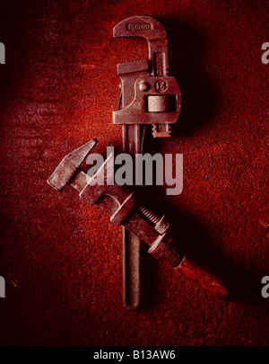 two wrenches a monkey wrenched an adjustable spanner on a rusty steel background shot in the studio Stock Photo