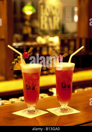Singapore Sling cocktail on Long Bar of  Raffles Hotel Singapore Stock Photo