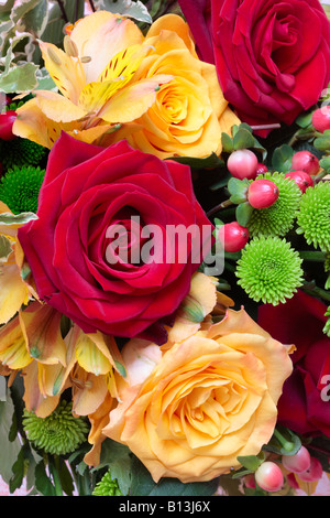 Bunch of Flowers with Red Roses, Yellow Roses, Chrysanthemum, Hypericum and Peruvian Lily (Alstroemeria). Stock Photo