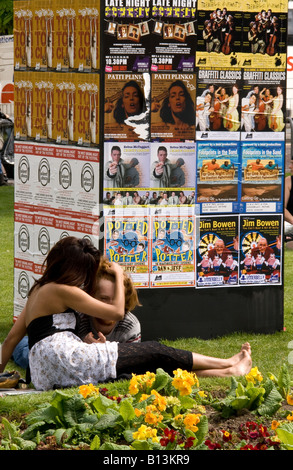 couple lying on the old steine lawns, outside the uderbelly Stock Photo