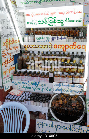 market stall with strange articles and medicinal herbs, superstition, KYAIKHTIYO PAGODA, MYANMAR BURMA BIRMA, ASIA Stock Photo