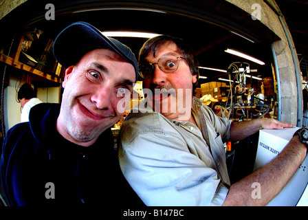 Two men pulling silly mad faces Stock Photo